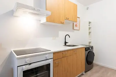 a small kitchen with a sink and a stove at Apartment over two floors for 5 guests near Midi & Grand Place in Brussels