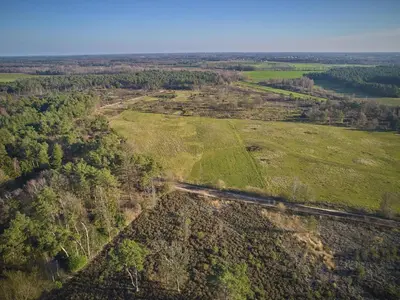 an aerial view of a field with a train at Lierelodge in Oud-Turnhout