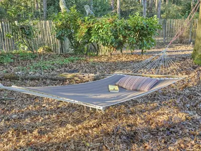 a hammock on the ground in a garden at Lierelodge in Oud-Turnhout