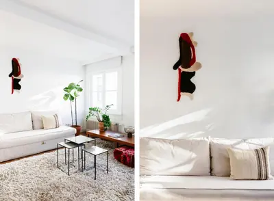 a living room with a white couch and a table at The Collector's House in Antwerp