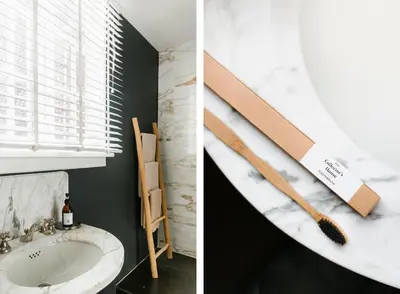 a bathroom with a sink and a counter with two wooden spatulas at The Collector's House in Antwerp