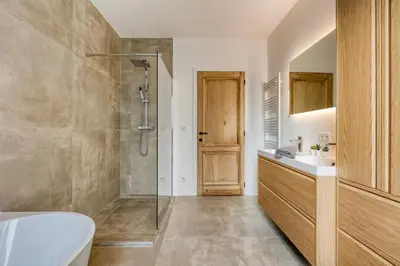 a bathroom with a shower and a sink and a tub at Spacious 3-bedroom apartment with terrace Zurenborg in Antwerp