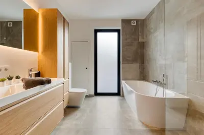 a bathroom with a tub and a toilet and a sink at Spacious 3-bedroom apartment with terrace Zurenborg in Antwerp