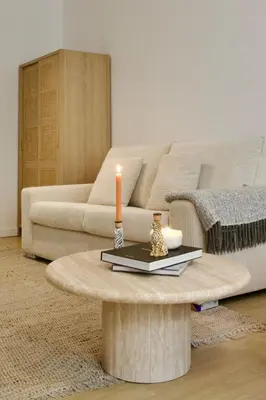 a living room with a couch and a coffee table at Hip apartment between South & Historic Antwerp in Antwerp