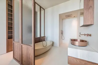 a bathroom with a tub and a sink at Montevideo Penthouse in Antwerp