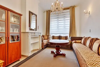 a living room with a couch and a table at Vanderdussen in Brussels