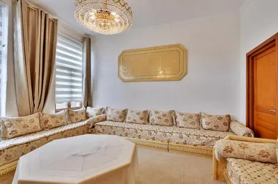 a living room with a couch and a table at Vanderdussen in Brussels