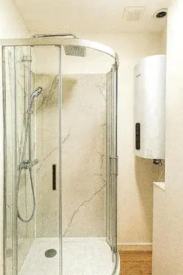 a shower with a glass enclosure in a bathroom at Brussels City Fresh Oasis in Brussels