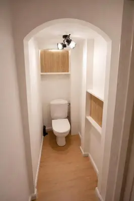 a bathroom with a white toilet in a room at Brussels City Fresh Oasis in Brussels