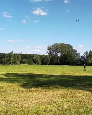 a person is flying a kite in a field at Villa West heaven Valley Gent in Ghent
