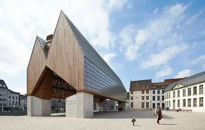 a woman and a child standing in front of a building at Villa West heaven Valley Gent in Ghent