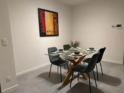 a dining room with a table and chairs at Business Accommodation Mol Centre in Mol