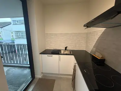 a kitchen with a sink and a counter top at Business Accommodation Mol Centre in Mol