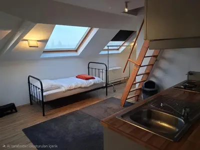 a small room with a bunk bed and a sink at apart studio no3 in Kortenberg