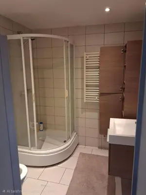 a bathroom with a shower and a toilet and a sink at apart studio no3 in Kortenberg