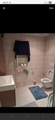 a small bathroom with a toilet and a sink at Apart studio3 in Kortenberg