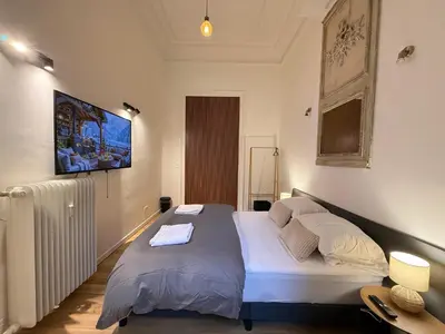 a bedroom with a large bed in a room at European Lodge Studio Brussels in Brussels