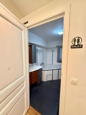 an open door to a kitchen with a sink at European Lodge Rooms Brussels in Brussels