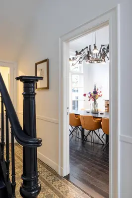 a dining room with a table and a chandelier at Inner-Homes in Antwerp