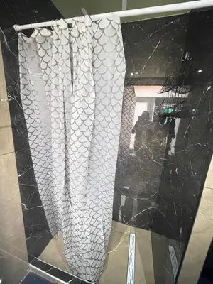 a glass window with a white shower curtain at Jps house in Brussels