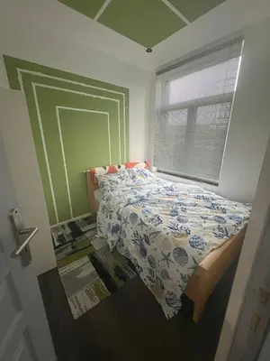 a bedroom with a bed and a window in it at Jps house in Brussels
