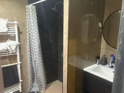 a bathroom with a shower and a sink at Jps house in Brussels