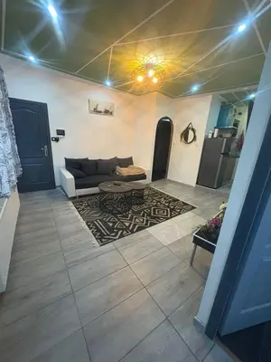 a living room with a couch and a table at Jps house in Brussels