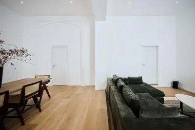 a living room with a couch and a table at Toison d'Or & saunna 2 in Brussels