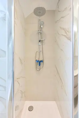 a shower with a shower head in a bathroom at Toison d'Or House 4 in Brussels