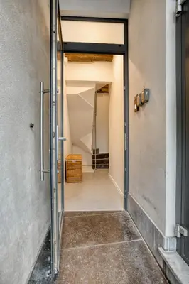 an open door to a hallway in a building at Cozy Stay in the Heart of Mechelen in Mechelen