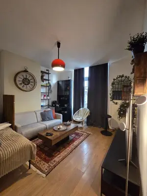 a living room with a couch and a coffee table at Pb155, balcony with street view in Brussels