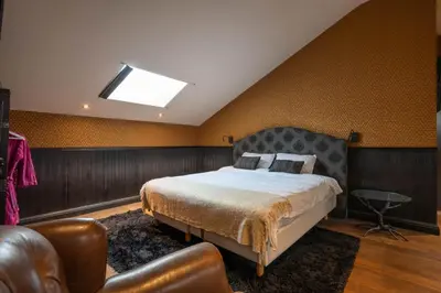 a bedroom with a bed and a skylight at Civiltà Boutique in Antwerp