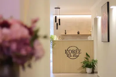 a bathroom with a sink and a counter with a sign that reads im more at Bed and Breakfast L'Orée Du Bois in Wavre