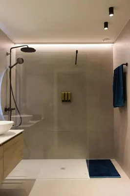 a shower with a glass door in a bathroom at Bed and Breakfast L'Orée Du Bois in Wavre