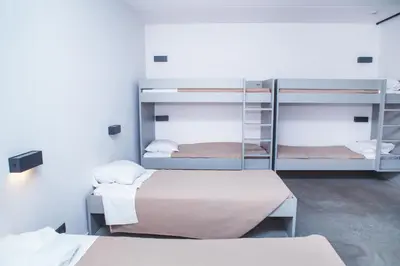 a room with three bunk beds in a room at Antwerp Central Youth Hostel in Antwerp