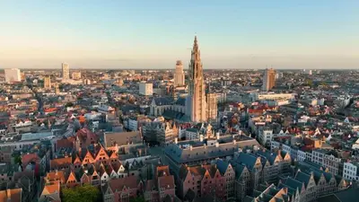 an aerial view of a city with a tall tower at GuestHouse Groenplaats in Antwerp