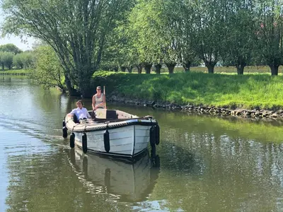 two people on a boat on a river at LoftAnno1940 in Lokeren