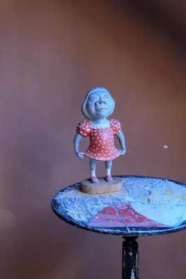 a small figurine of a girl on a surfboard at 15 inn in Mol