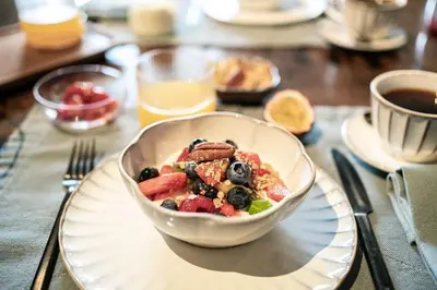 a bowl of food sitting on a plate on a table at 15 inn in Mol