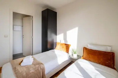 two beds sitting next to each other in a room at Brussels EU Center residence in Brussels
