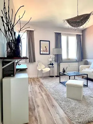 a living room with a couch and a table at Lovely appartment - Heart of Brussels for 2 view over the city in Brussels