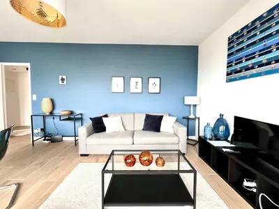 a living room with a couch and a table at lovely 2room Elegant Apartment in Brussels for 2people in Brussels