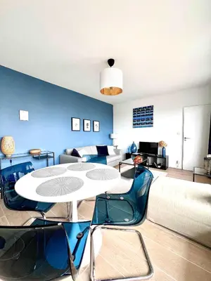 a living room with a table and chairs at lovely 2room Elegant Apartment in Brussels for 2people in Brussels