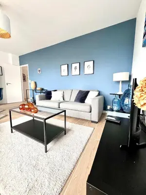 a living room with a couch and a table at lovely 2room Elegant Apartment in Brussels for 2people in Brussels
