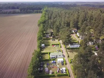 an aerial view of a farm next to a field at 6-Guest Escape with Private Garden & Wi-Fi in Ravels