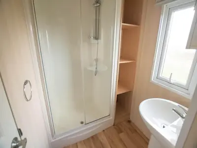 a bathroom with a shower and a sink at 3-Bedroom Central Retreat in Ravels in Ravels