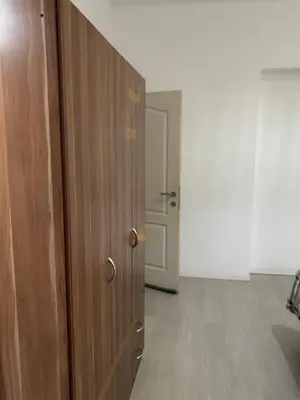 a wooden door in a room with a hallway at Suzanne house in Brussels