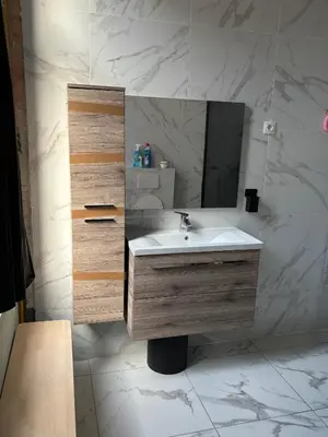 a bathroom with a sink and a mirror at Suzanne house in Brussels