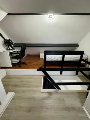a room with a bunk bed and a desk at Duplex near Brussels Airport with washing machine in Vilvoorde