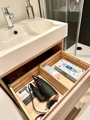 a bathroom with a sink and a drawer with a sink at European Quarter Studio in Brussels